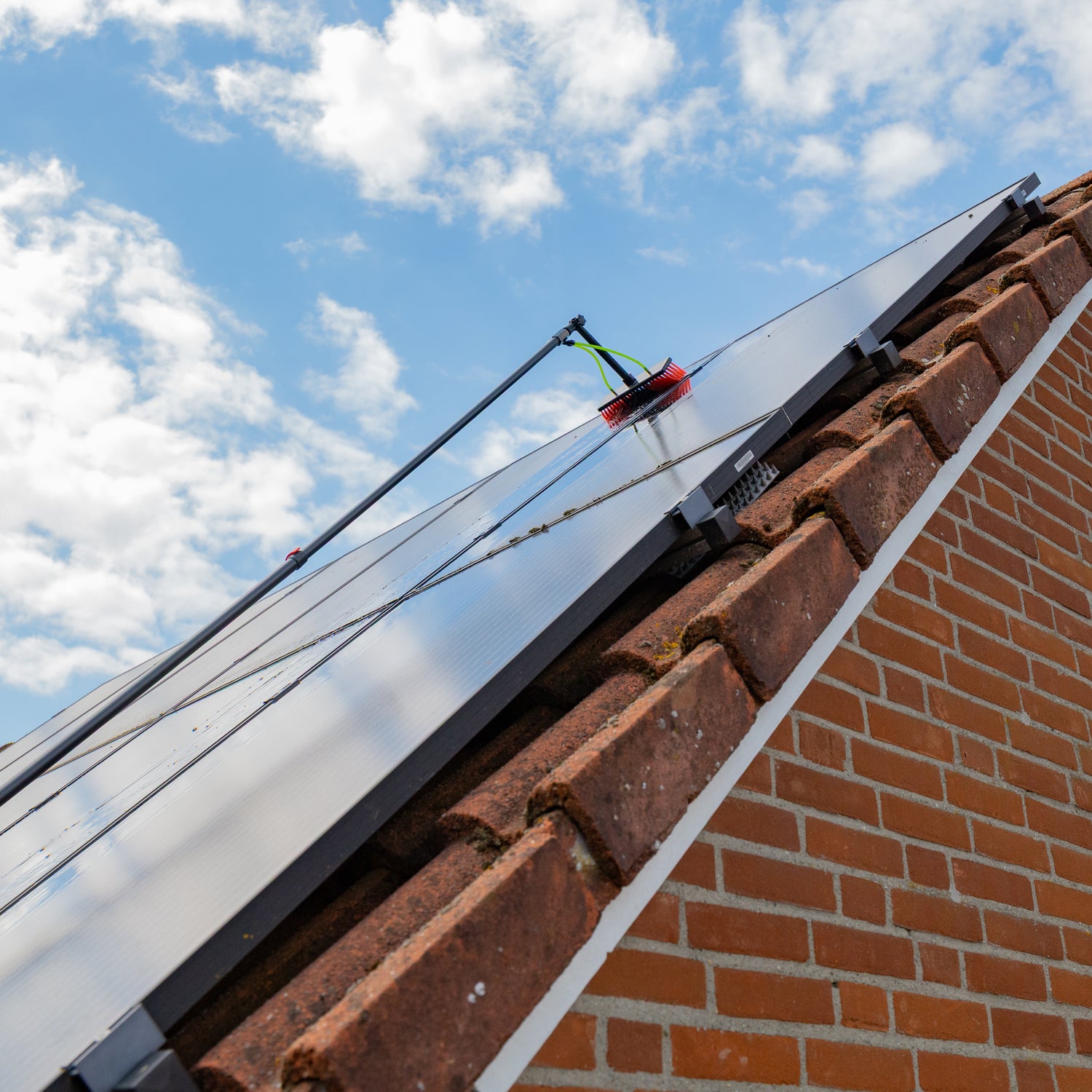 Cleaning solar panels using the standard brush