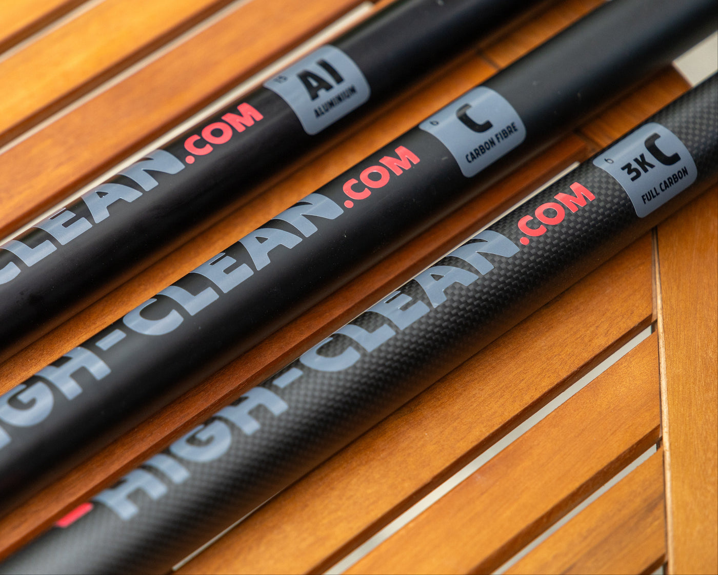 Telescopic poles of three different materials shown next to each other