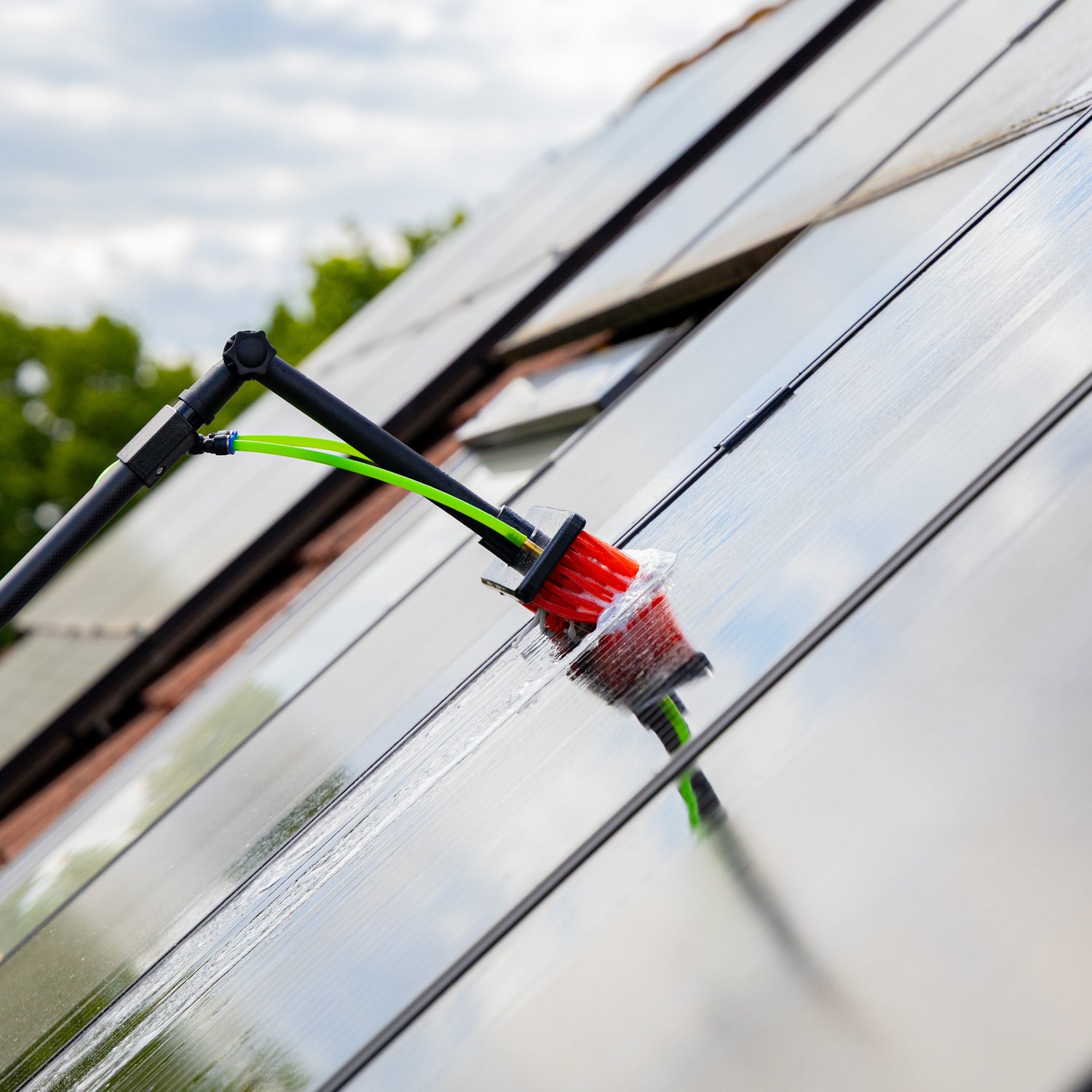 Cleaning solar panels using the standard brush