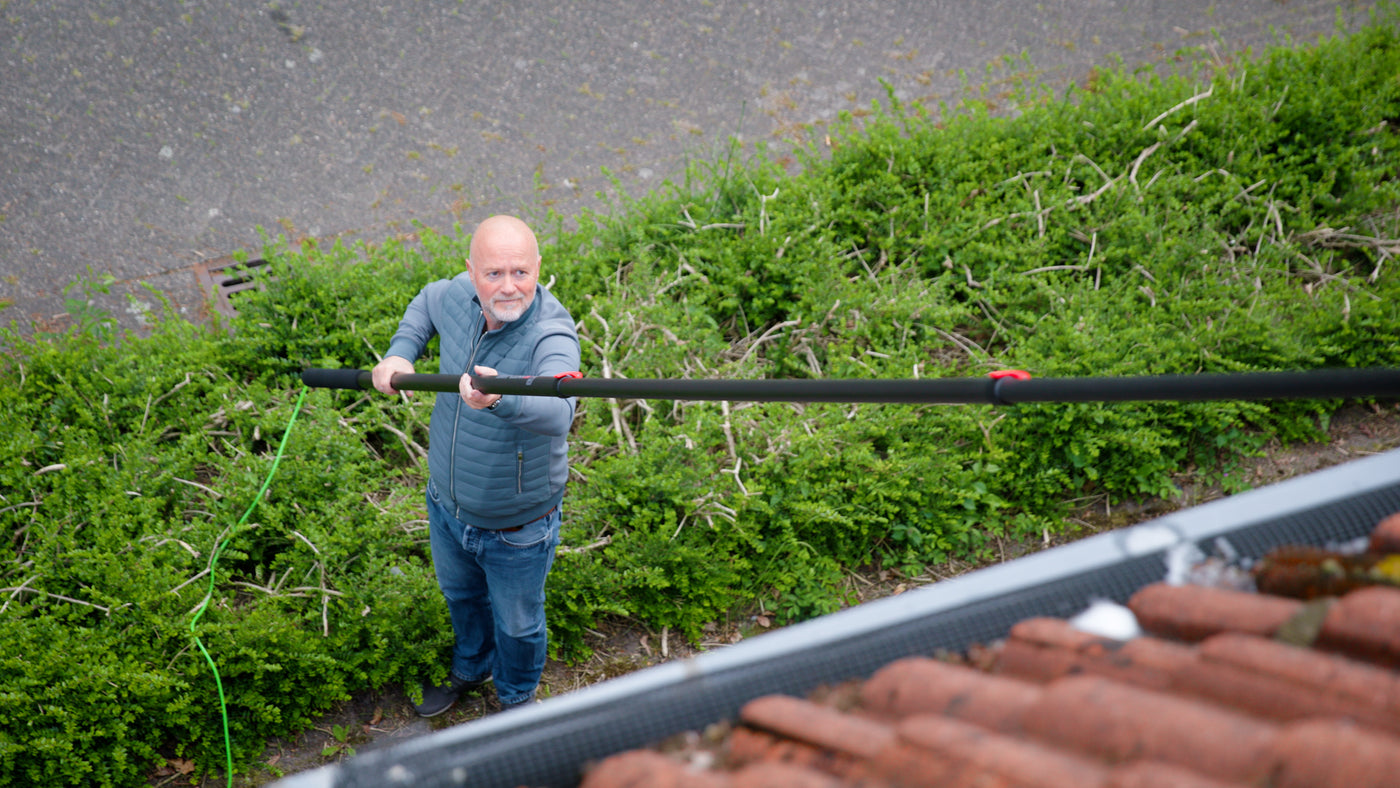 Cleaning solar panels shown from the roof