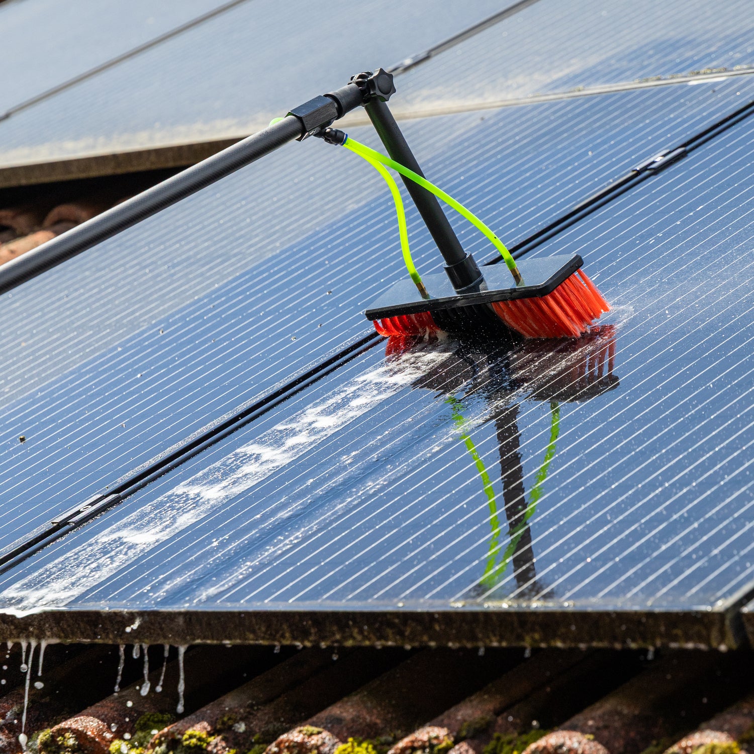 Cleaning solar panels using the standard brush