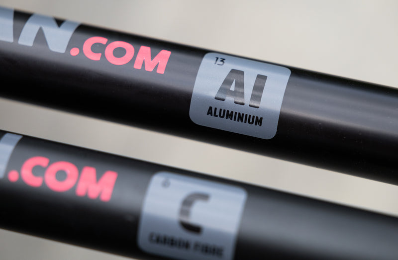 The aluminum and carbon fibre poles next to each other