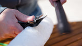 Opening the clasp for attaching a wiper to the washer-wiper set