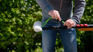 Attaching the tube of a washer-wiper set to the tube in a telescopic pole