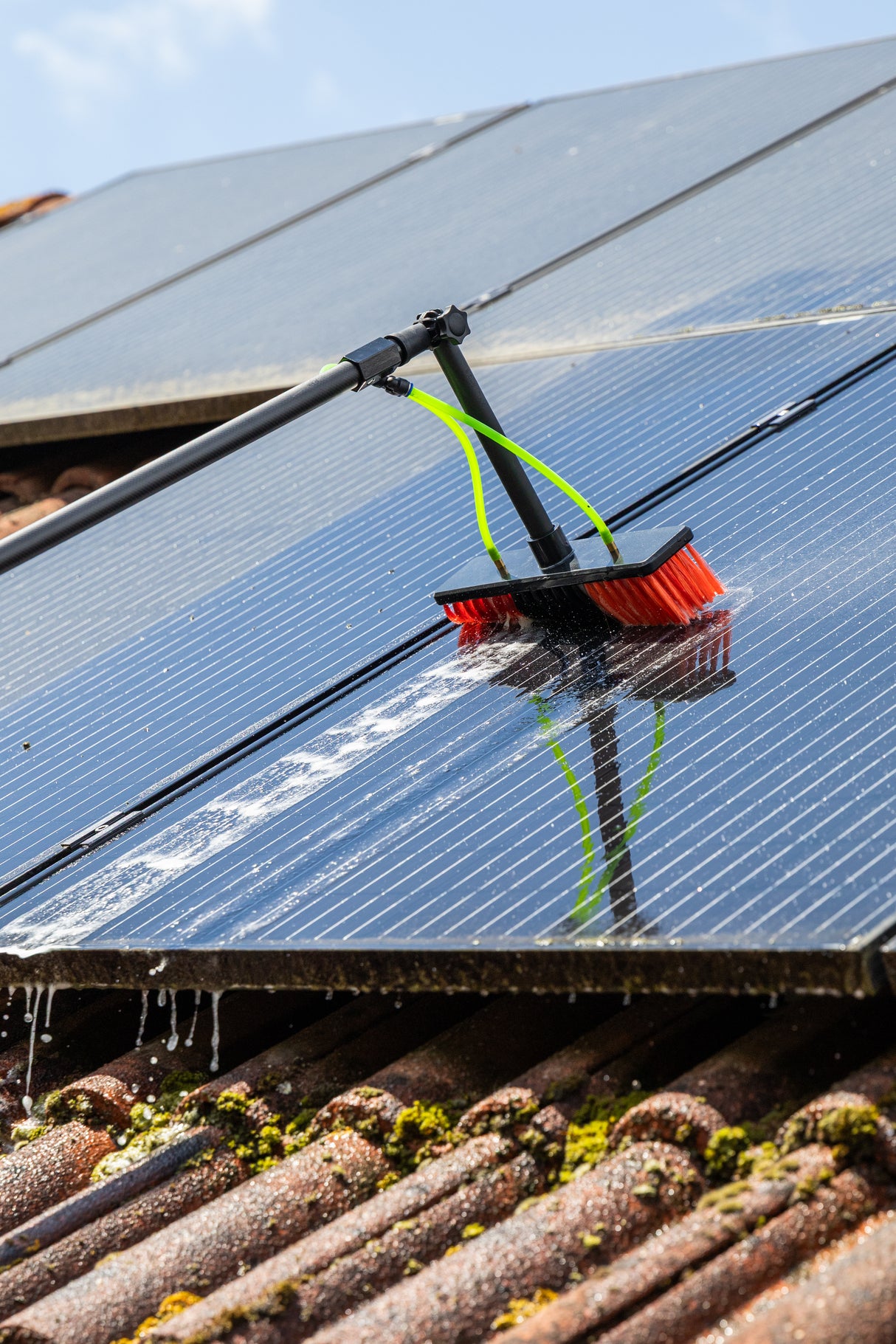 Cleaning solar panels using the standard brush