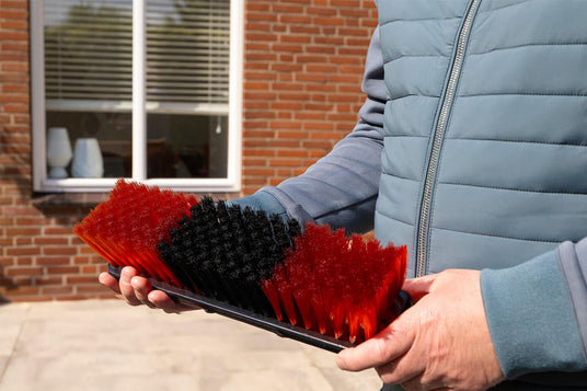 The standard brush held by someone
