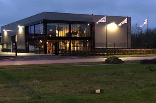 The company building at dusk